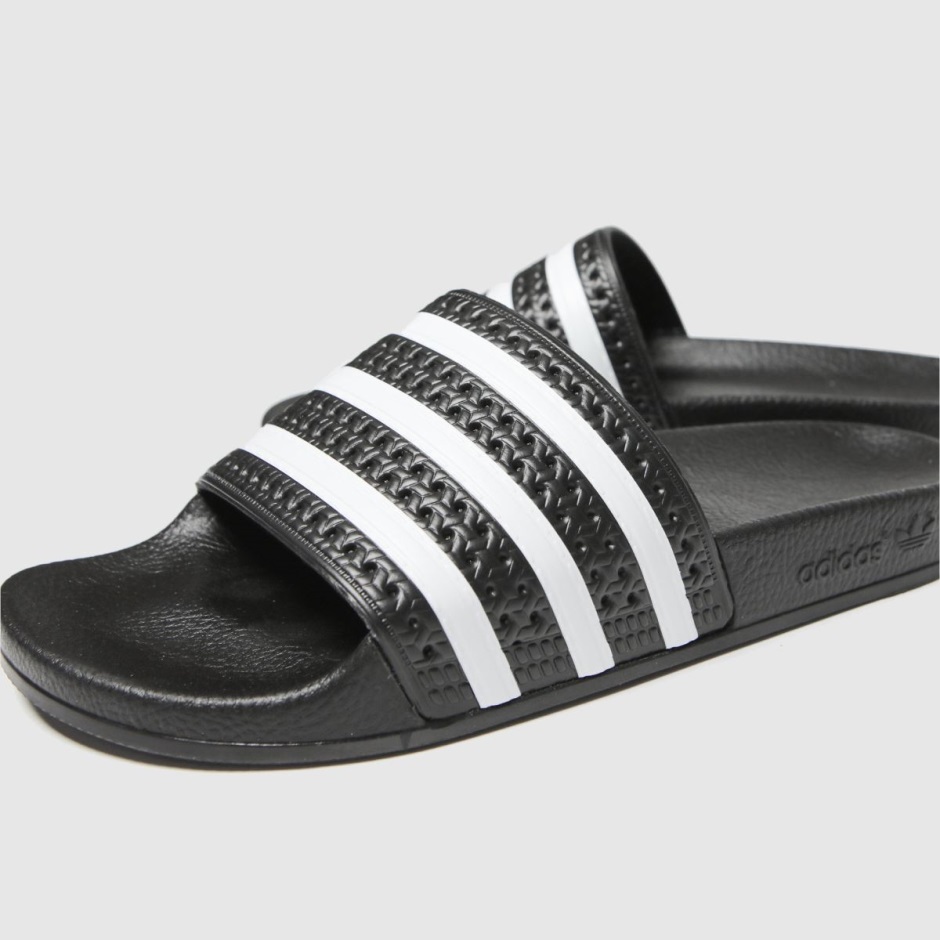 Black-white Dr Martens Schweiz Adidas Adilette Sandals
